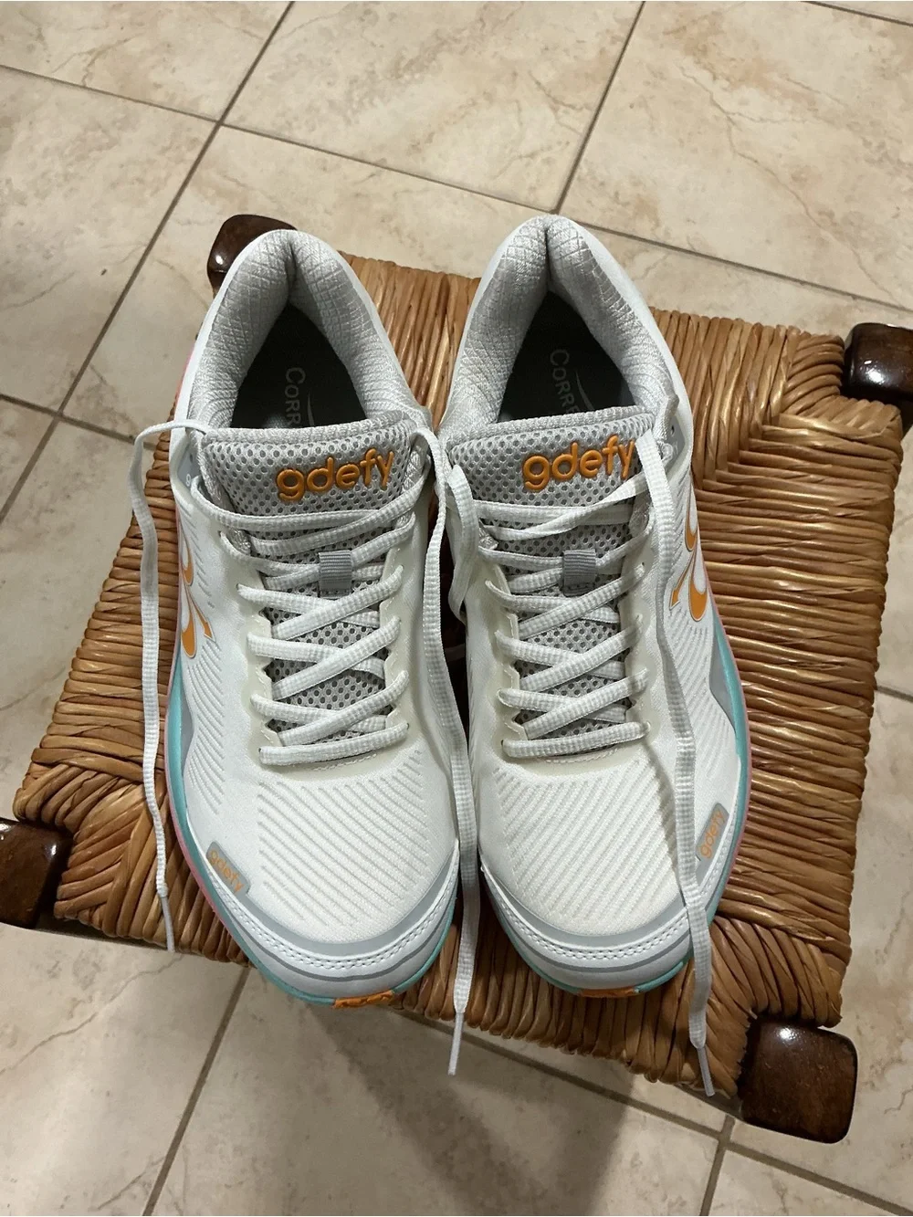 Women’s White Athletic Running Shoe with Pastel Pink, Aqua, and Orange Accents